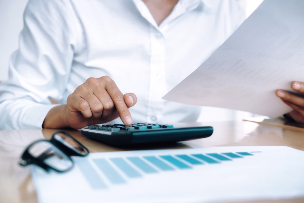 finances-saving-economy-concept-female-accountant-banker-use-calculator.jpg